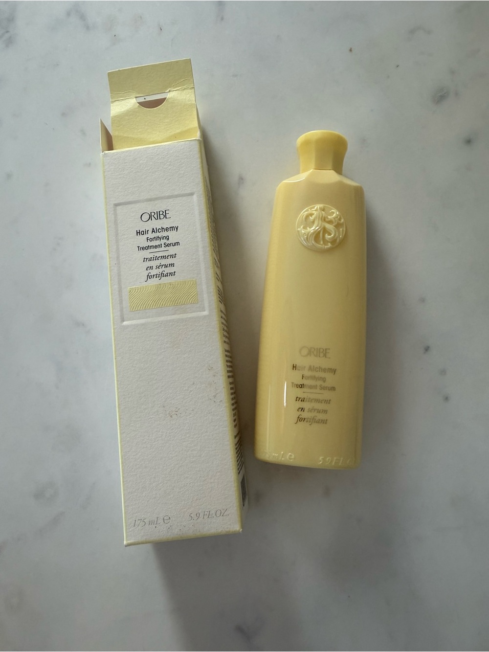 Oribe Pale Yellow Hair Alchemy Fortifying Treatment Serum Bottle